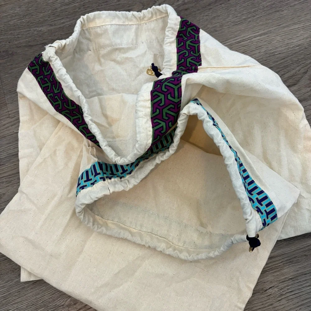 Set of 2 Tory Burch drawstring dust bags, canvas with gold charm